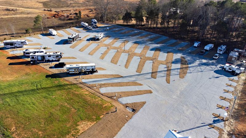 Aerial of an RV park with campers parked in angled sites