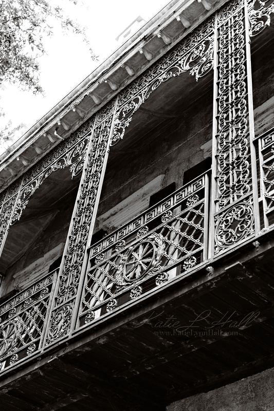 Ornate iron balcony in black and white