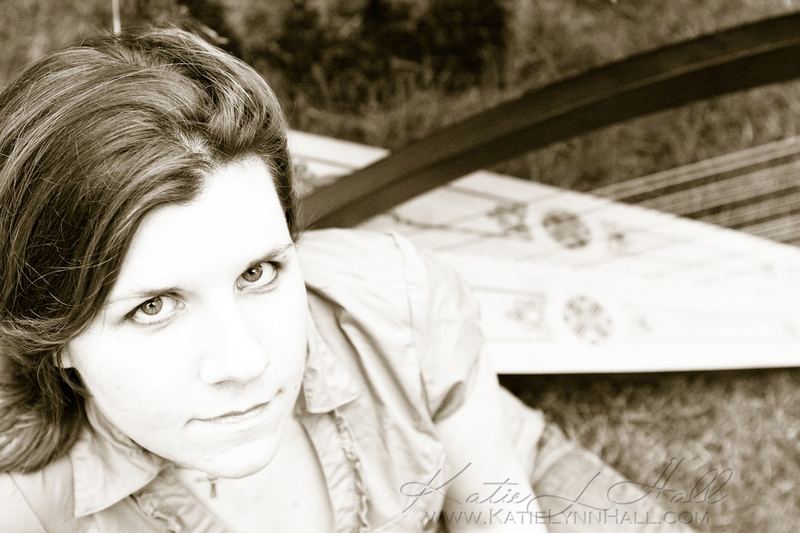 Sepia portrait of a woman resting on a garden bench